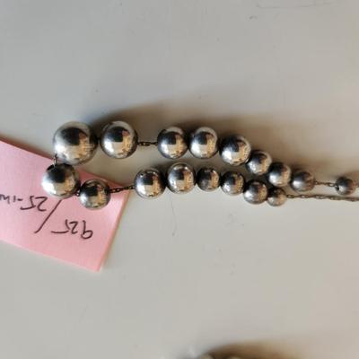 Sale Photo Thumbnail #17: This auction lot is for a collection of Jewelry with Sterling Silver Balls.  This offering includes a bracelet with original tag attached and two necklaces one measures 23-inches and the other 25-inches - both with cascading sterling silver balls. All are