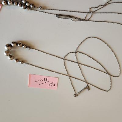 Sale Photo Thumbnail #15: This auction lot is for a collection of Jewelry with Sterling Silver Balls.  This offering includes a bracelet with original tag attached and two necklaces one measures 23-inches and the other 25-inches - both with cascading sterling silver balls. All are
