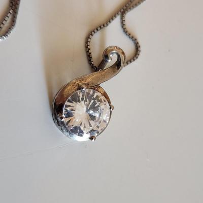 Sale Photo Thumbnail #23: This auction lot is for Four Sterling Silver Necklaces. Three necklace are marked 925.  There is a 16-inch necklace with a large cut glass stone, another 14-inch necklace with a pendant of silver overlay on jade stone, a very delicate 17-inch chain with a