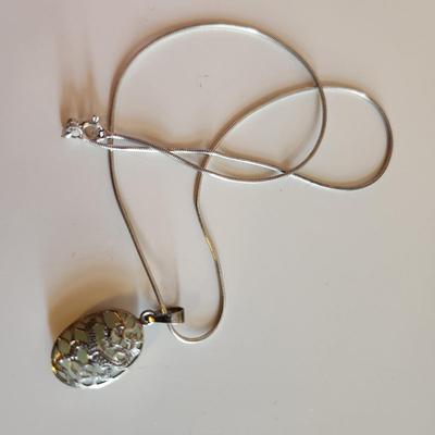 Sale Photo Thumbnail #32: This auction lot is for Four Sterling Silver Necklaces. Three necklace are marked 925.  There is a 16-inch necklace with a large cut glass stone, another 14-inch necklace with a pendant of silver overlay on jade stone, a very delicate 17-inch chain with a