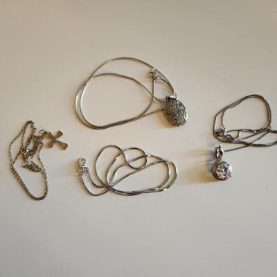 Sale Photo Thumbnail #36: This auction lot is for Four Sterling Silver Necklaces. Three necklace are marked 925.  There is a 16-inch necklace with a large cut glass stone, another 14-inch necklace with a pendant of silver overlay on jade stone, a very delicate 17-inch chain with a