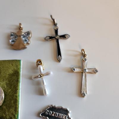 Sale Photo Thumbnail #40: This auction lot is for a Collection of Sterling Silver Charms & Crosses.  This is a fun grouping of small items.  The Sweet 16, Cozumel and pearl cross are not marked but we feel are precious.  The angel is marked 925 and the remaining two crosses are ma
