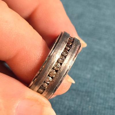 Sale Photo Thumbnail #46: This auction lot is for a Man's Tungsten Carbide Wedding Ring. This man's wedding ring is made of Tungsten Carbide Steel and embedded with 11 lab-grown diamonds.  It is not only very handsome - it is virtually indestructible.  These rings are designed for
