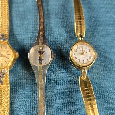Sale Photo Thumbnail #71: This auction lot is for a Quint of Vintage Ladies Watches. This is a fun grouping of 5 ladies watches.  All need batteries.  From left to right the watch brands are:  Faded Glory (blue face), Seico, Gruen, Benrus (diamond quartz), and lastly, a Benrus (17