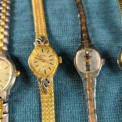 Sale Photo Thumbnail #70: This auction lot is for a Quint of Vintage Ladies Watches. This is a fun grouping of 5 ladies watches.  All need batteries.  From left to right the watch brands are:  Faded Glory (blue face), Seico, Gruen, Benrus (diamond quartz), and lastly, a Benrus (17