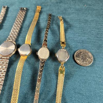Sale Photo Thumbnail #73: This auction lot is for a Quint of Vintage Ladies Watches. This is a fun grouping of 5 ladies watches.  All need batteries.  From left to right the watch brands are:  Faded Glory (blue face), Seico, Gruen, Benrus (diamond quartz), and lastly, a Benrus (17