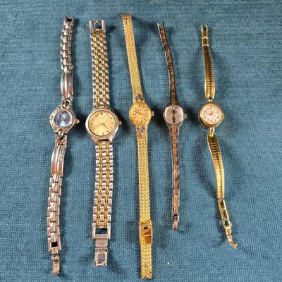 Sale Photo Thumbnail #67: This auction lot is for a Quint of Vintage Ladies Watches. This is a fun grouping of 5 ladies watches.  All need batteries.  From left to right the watch brands are:  Faded Glory (blue face), Seico, Gruen, Benrus (diamond quartz), and lastly, a Benrus (17
