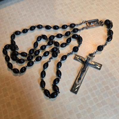 Sale Photo Thumbnail #77: This auction lot is for a Black Beaded Rosary. This is a very nice Black Beaded Rosary..  It has Rome etched on the back of the cross,  This most likely was used for a young man's First Communion.  It is in very good condition.