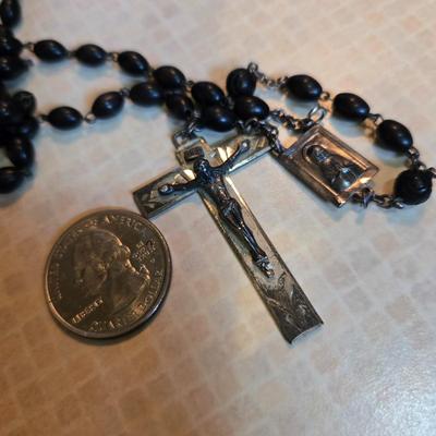 Sale Photo Thumbnail #79: This auction lot is for a Black Beaded Rosary. This is a very nice Black Beaded Rosary..  It has Rome etched on the back of the cross,  This most likely was used for a young man's First Communion.  It is in very good condition.