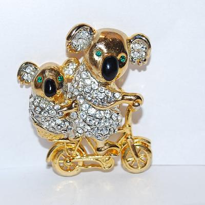 Mom & Baby KOALA BEARS BROOCH (1¾" x 1½") with Bejeweled Bodies, Green Eyes and Riding a Gold Tone BICYCLE