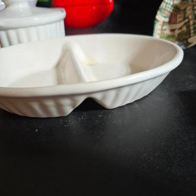 Oven and microwave safe Stoneware dishes with an assortment of themed basket cloths, small cookbooks, and a red pepper salsa dish