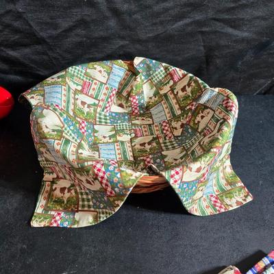 Oven and microwave safe Stoneware dishes with an assortment of themed basket cloths, small cookbooks, and a red pepper salsa dish