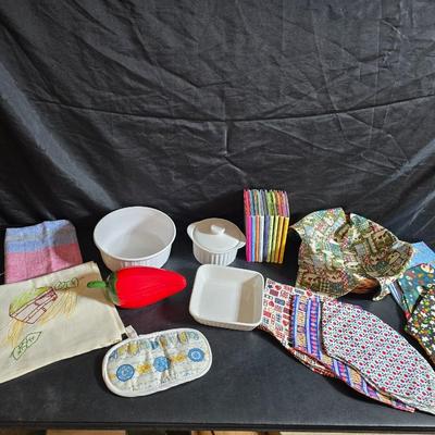 Oven and microwave safe Stoneware dishes with an assortment of themed basket cloths, small cookbooks, and a red pepper salsa dish
