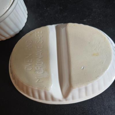 Oven and microwave safe Stoneware dishes with an assortment of themed basket cloths, small cookbooks, and a red pepper salsa dish