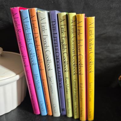 Oven and microwave safe Stoneware dishes with an assortment of themed basket cloths, small cookbooks, and a red pepper salsa dish