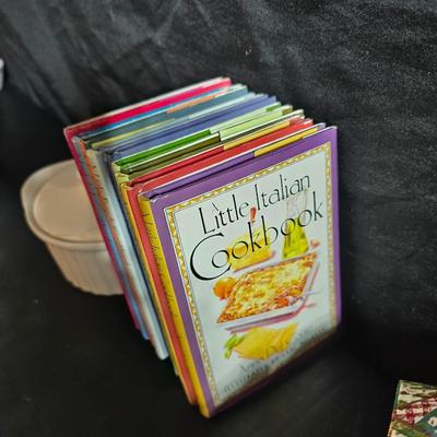 Oven and microwave safe Stoneware dishes with an assortment of themed basket cloths, small cookbooks, and a red pepper salsa dish