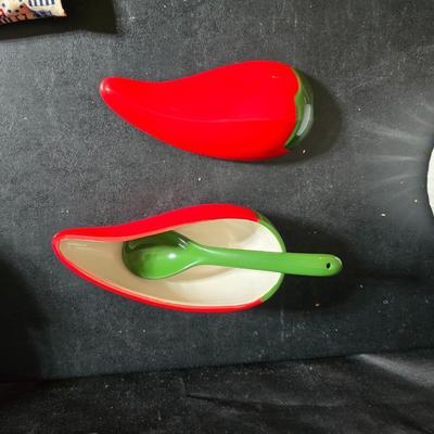 Oven and microwave safe Stoneware dishes with an assortment of themed basket cloths, small cookbooks, and a red pepper salsa dish