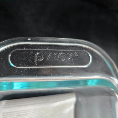 Two glass pyrex cake pans, two new glass Pyrex bread loaf pans and a nice cookie sheet