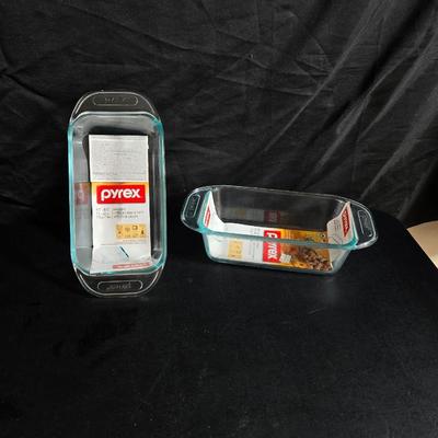 Two glass pyrex cake pans, two new glass Pyrex bread loaf pans and a nice cookie sheet