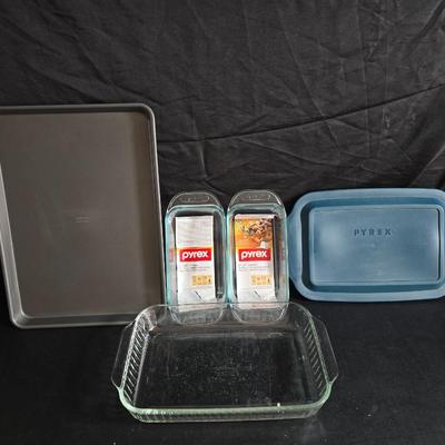 Two glass pyrex cake pans, two new glass Pyrex bread loaf pans and a nice cookie sheet
