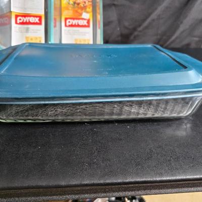 Two glass pyrex cake pans, two new glass Pyrex bread loaf pans and a nice cookie sheet