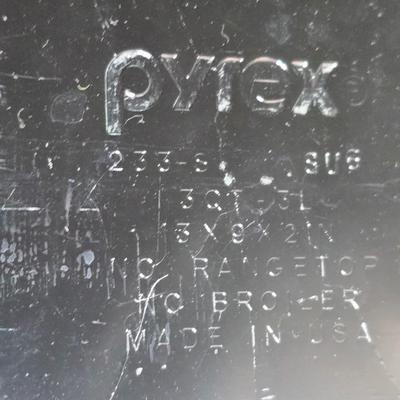 Two glass pyrex cake pans, two new glass Pyrex bread loaf pans and a nice cookie sheet