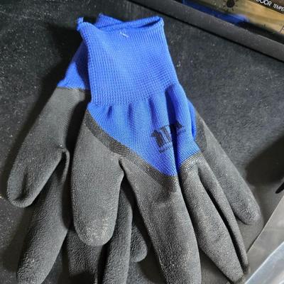 Two brand new deck brackets - a nice sprinkler - work gloves and a Polaroid digital picture frame with outdoor temperature display