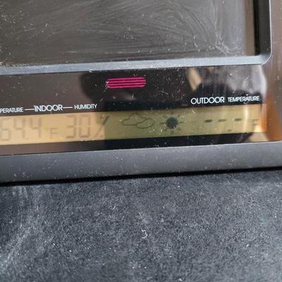 Two brand new deck brackets - a nice sprinkler - work gloves and a Polaroid digital picture frame with outdoor temperature display