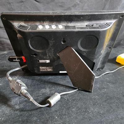 Two brand new deck brackets - a nice sprinkler - work gloves and a Polaroid digital picture frame with outdoor temperature display