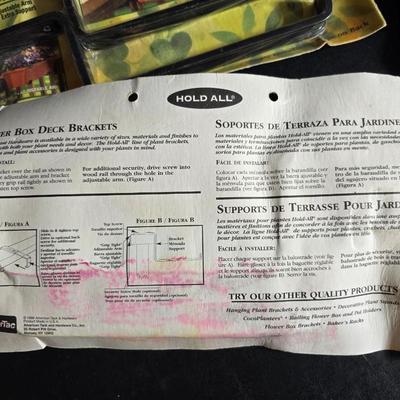 Two brand new deck brackets - a nice sprinkler - work gloves and a Polaroid digital picture frame with outdoor temperature display