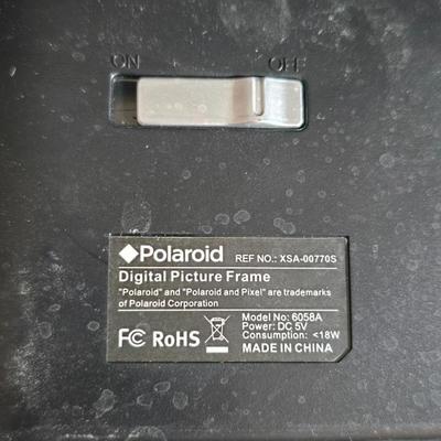 Two brand new deck brackets - a nice sprinkler - work gloves and a Polaroid digital picture frame with outdoor temperature display