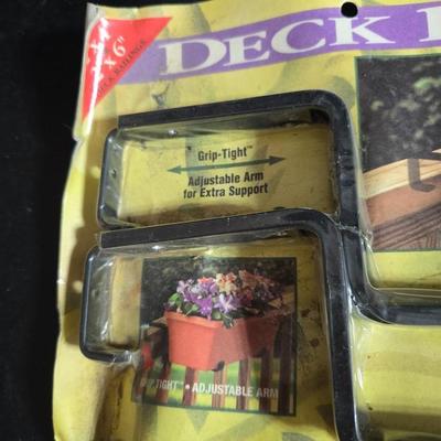 Two brand new deck brackets - a nice sprinkler - work gloves and a Polaroid digital picture frame with outdoor temperature display