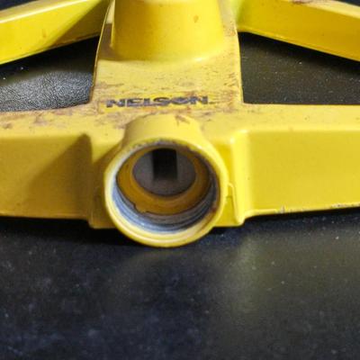 Two brand new deck brackets - a nice sprinkler - work gloves and a Polaroid digital picture frame with outdoor temperature display