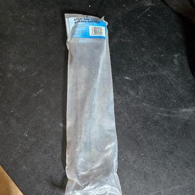 Two brand new deck brackets - a nice sprinkler - work gloves and a Polaroid digital picture frame with outdoor temperature display