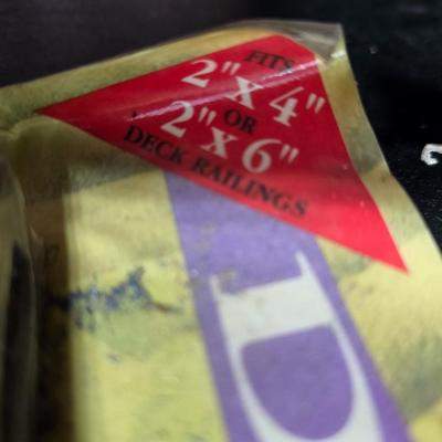 Two brand new deck brackets - a nice sprinkler - work gloves and a Polaroid digital picture frame with outdoor temperature display