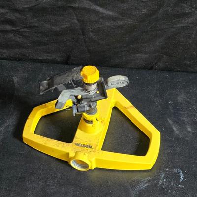 Two brand new deck brackets - a nice sprinkler - work gloves and a Polaroid digital picture frame with outdoor temperature display