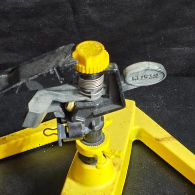 Two brand new deck brackets - a nice sprinkler - work gloves and a Polaroid digital picture frame with outdoor temperature display