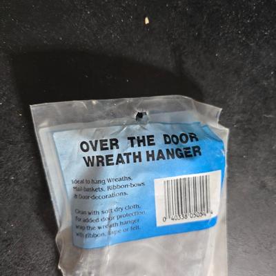 Two brand new deck brackets - a nice sprinkler - work gloves and a Polaroid digital picture frame with outdoor temperature display