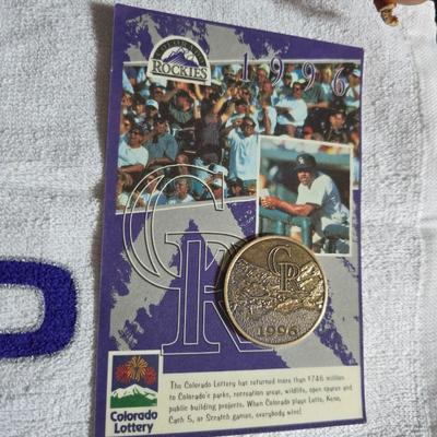 Baseball - brand new Rawlings batter helmet - leather baseball glove with ball and Rockies memorabilia