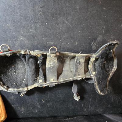 Vintage baseball helmets with pads and a vintage leather glove