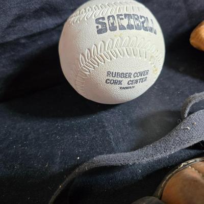 Vintage baseball helmets with pads and a vintage leather glove