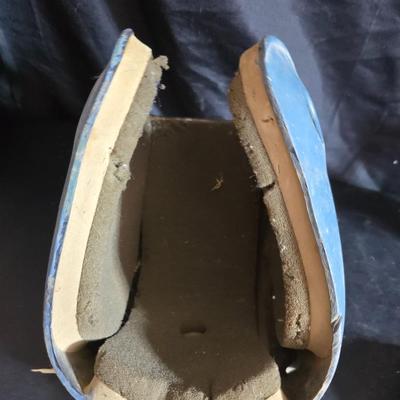 Vintage baseball helmets with pads and a vintage leather glove