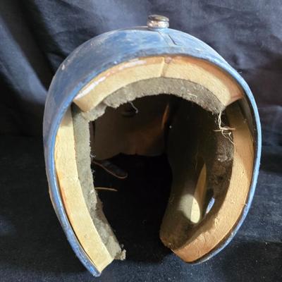 Vintage baseball helmets with pads and a vintage leather glove