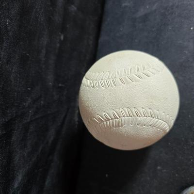 Vintage baseball helmets with pads and a vintage leather glove