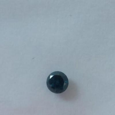 0.045 carat irradiated blue-green diamond