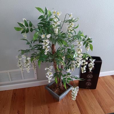 FAUX FLOWERING PLANT AND A FLOOR VASE