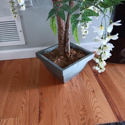 FAUX FLOWERING PLANT AND A FLOOR VASE
