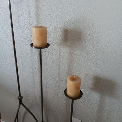 A TRIO OF HAND FORGED FLOOR CANDLE HOLDERS