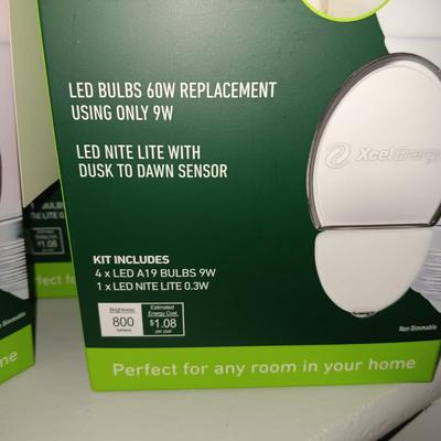 5 FULL BOXES OF LED 60W LIGHT BULBS WITH DUSK TO DAWN SENSOR
