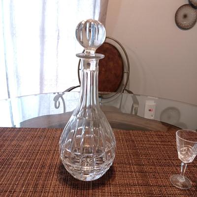 CRYSTAL DECANTER, 5 SMALL STEMMED GLASSES AND CRYSTAL VOTIVE CANDLE HOLDERS